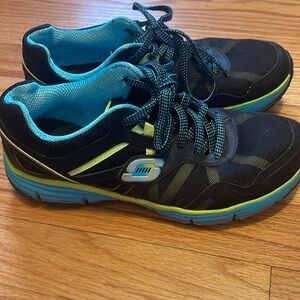 Neon and black Skechers shoes
